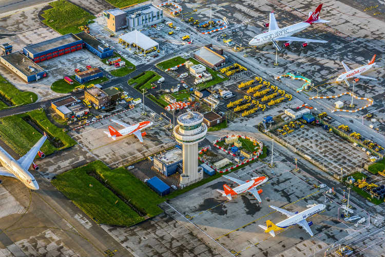 Staff write flight times on whiteboards as Gatwick screens fail