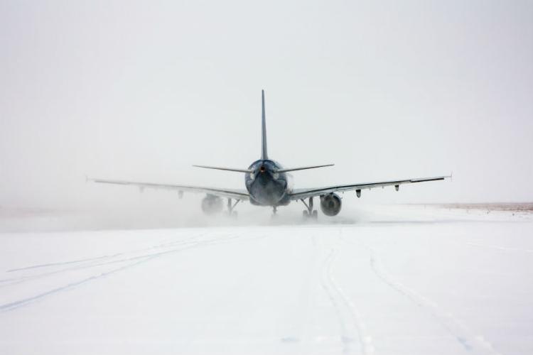 Snow continues to cause flight chaos
