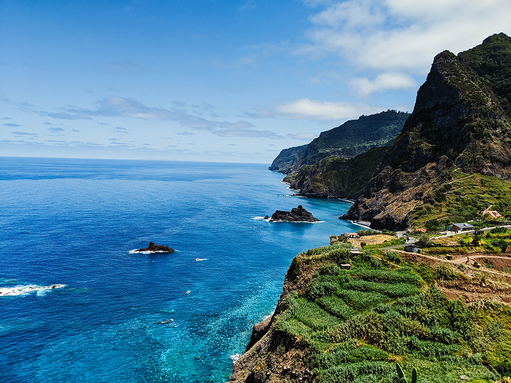 Madeira's beautiful coastline features verdant cliffs and azure waters (Credit: Stephen Lammens/Unsplash)